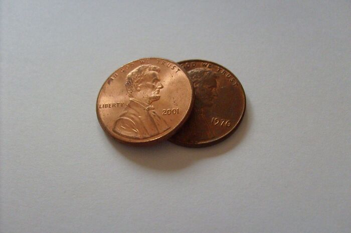 Two US pennies on a light surface. This image symbolizes the value in amazing comebacks.