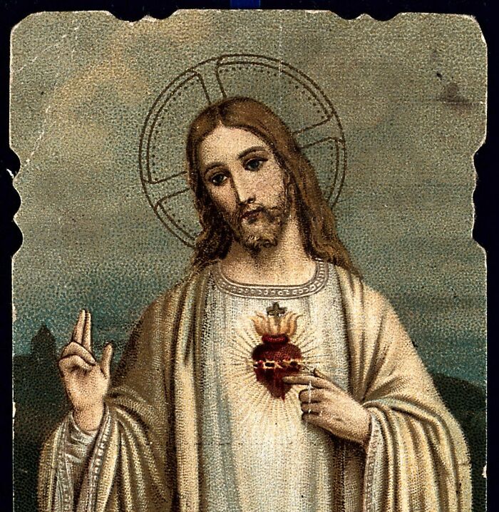 An old religious depiction of Jesus with a glowing heart, representing unsettling childhood memories.