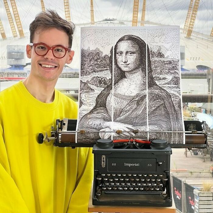 A brilliant design choice: a man proudly stands next to a large Mona Lisa portrait made using a typewriter.