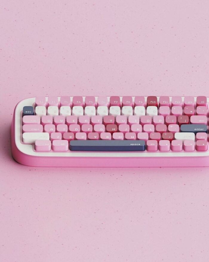 A brilliant design choice: a pink keyboard with various shades of pink keys on a matching pink background, surprising people.