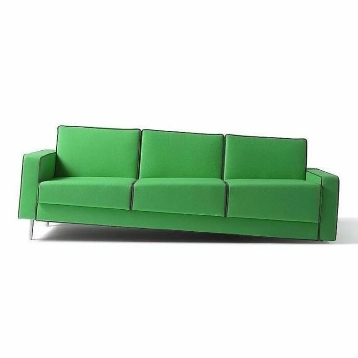 A brilliant design choice for furniture: a vibrant green sofa with an unusual slanted base, surprising people.