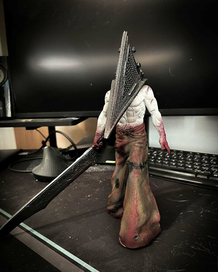 A detailed 3D printing of Pyramid Head from Silent Hill, showcasing amazing creations by fans.