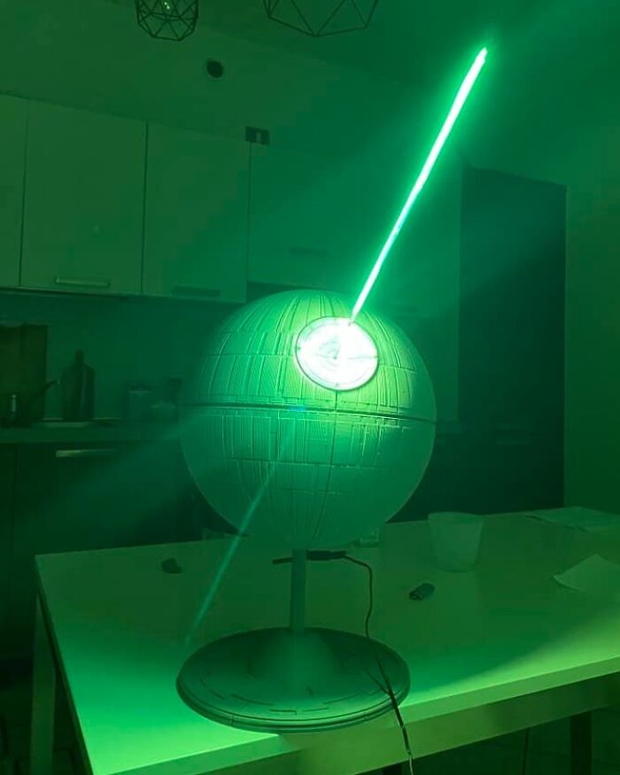 A 3D printing creation of the D***h Star emitting a green laser beam, an amazing 3D printing creation by fans.