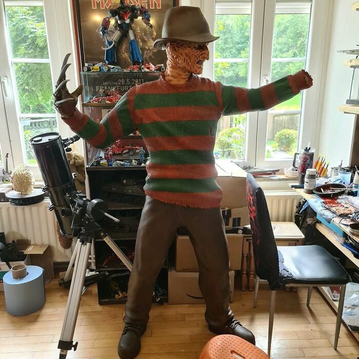 A life-sized Freddy Krueger 3D printing model in a room with a telescope and various amazing creations.