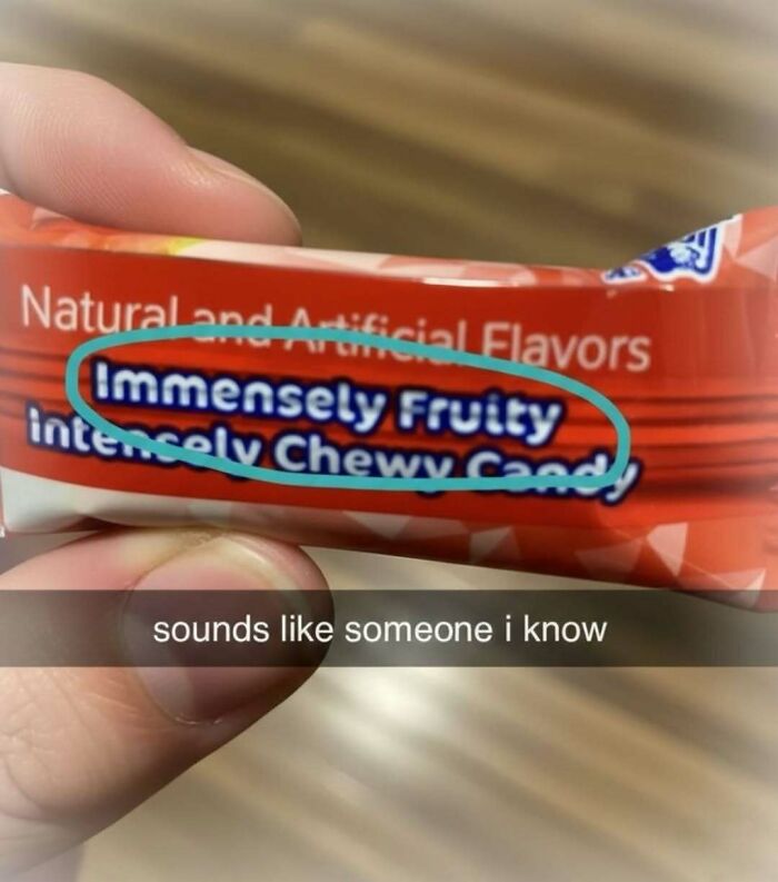 A hand holding a candy wrapper with the words Immensely Fruity Intensely Chewy Candy circled. A hilarious meme about personality.