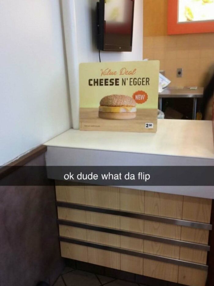 Hilarious memes and roasts: A sign for a 'Cheese N Egg' burger at a fast-food counter, with a Snapchat caption.