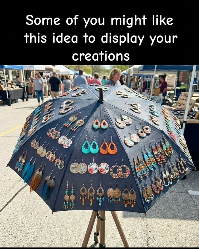 An umbrella display for handmade earrings, a clever craft project for showcasing creations.