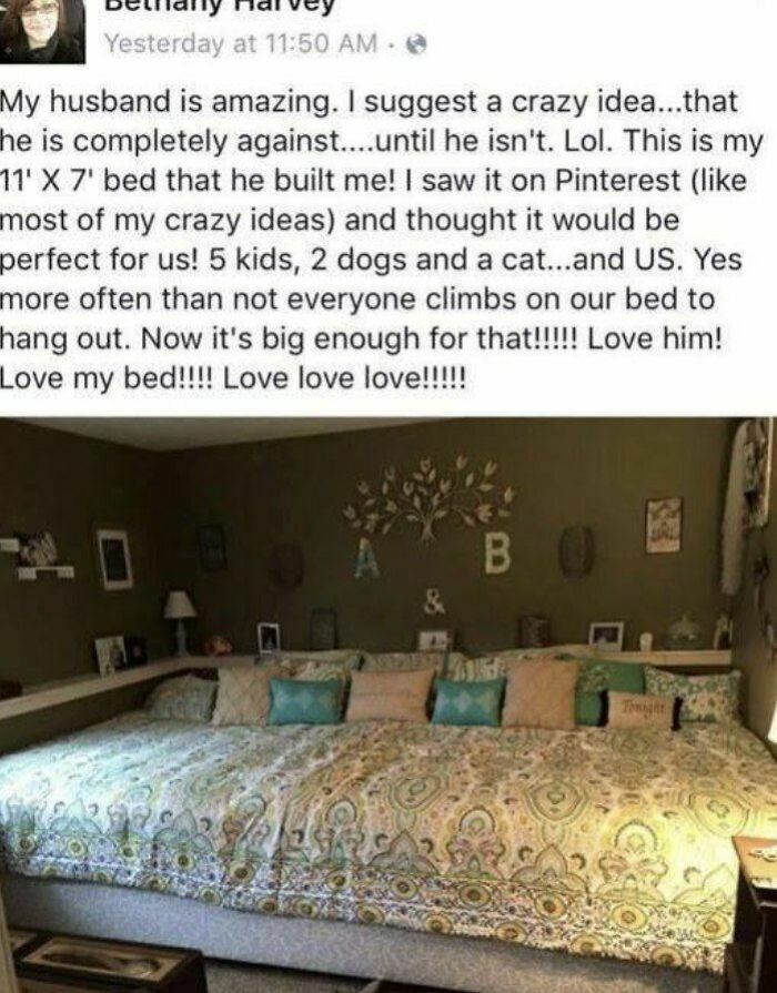 A massive, custom-built 11' X 7' bed with a patterned duvet and many pillows, a clever home craft project.