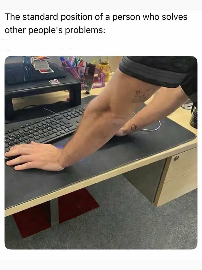 Funny image capturing the reality of being an adult, showing an arm awkwardly reaching for a keyboard.