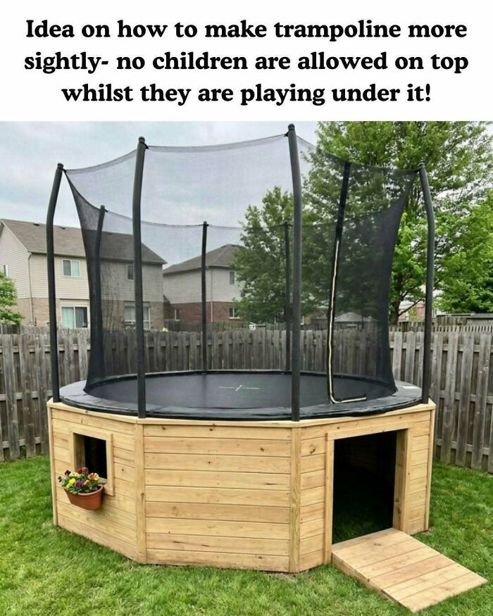 A trampoline enclosed in a wooden structure with a play area underneath, a clever craft project.