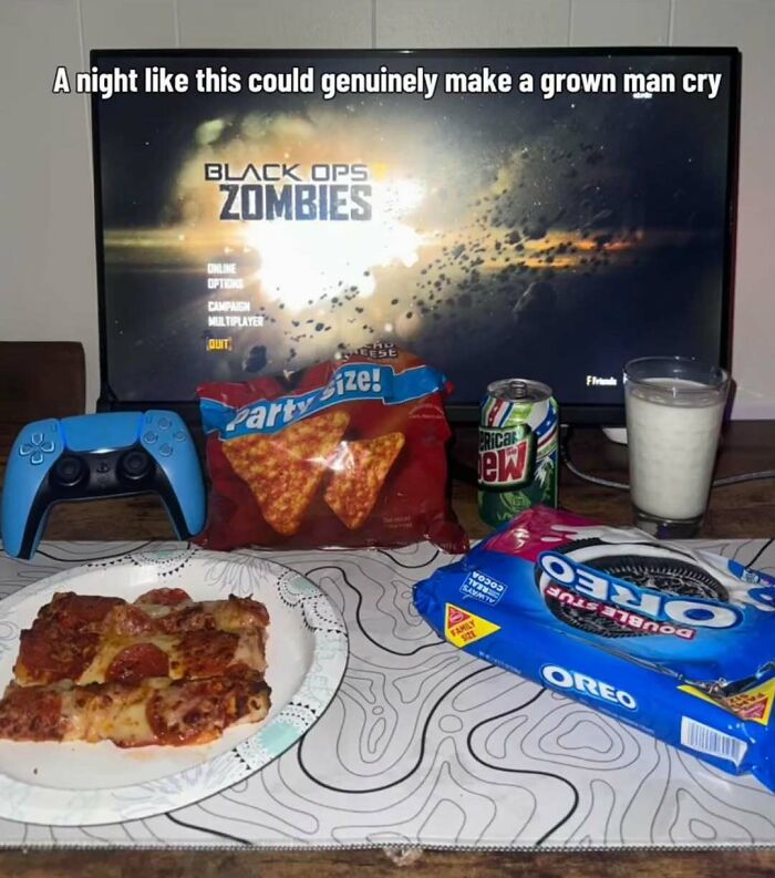 A gamer's setup with pizza, snacks, and Black Ops Zombies on screen, creating cringe memes.