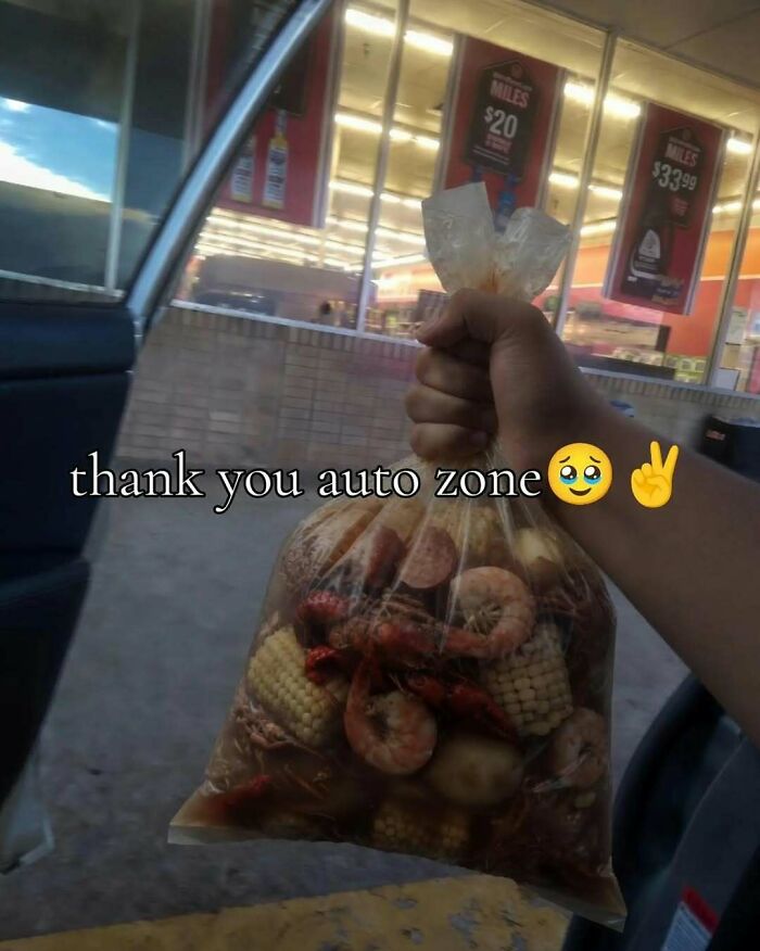 A hand holding a plastic bag of crawfish boil outside a store, featured in cringe memes.