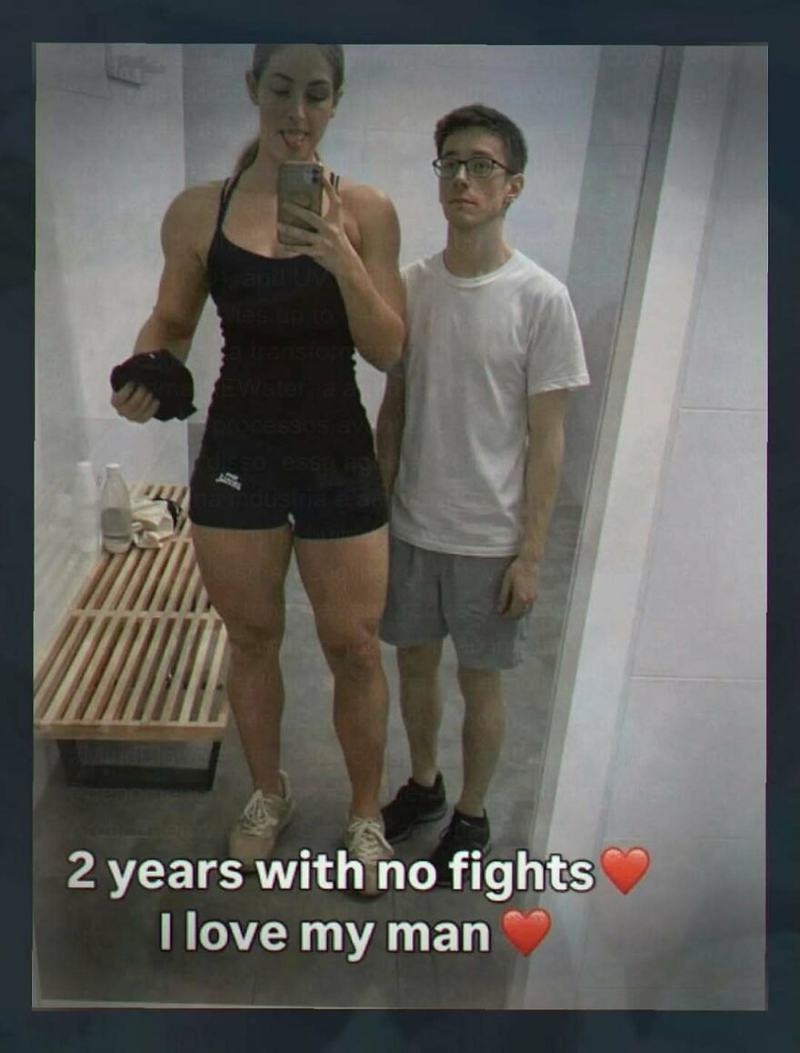 A funny screenshot of a very tall, muscular woman and a shorter man, captioned 2 years with no fights I love my man.