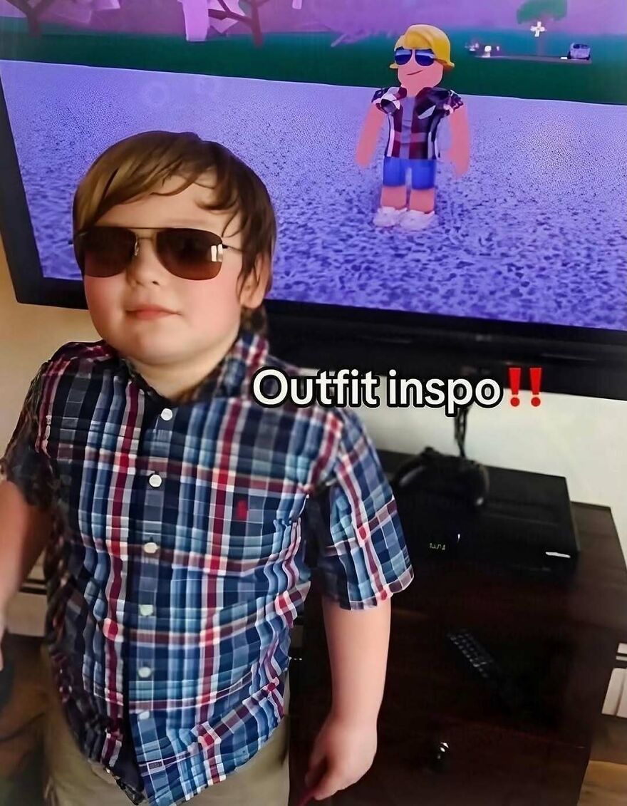 A young child wearing sunglasses and a plaid shirt, mimicking a Roblox avatar, showing funny outfit inspiration.