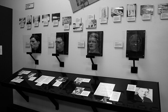 A museum exhibit showcasing historical crime scene evidence, focusing on mystery cases and their blame.