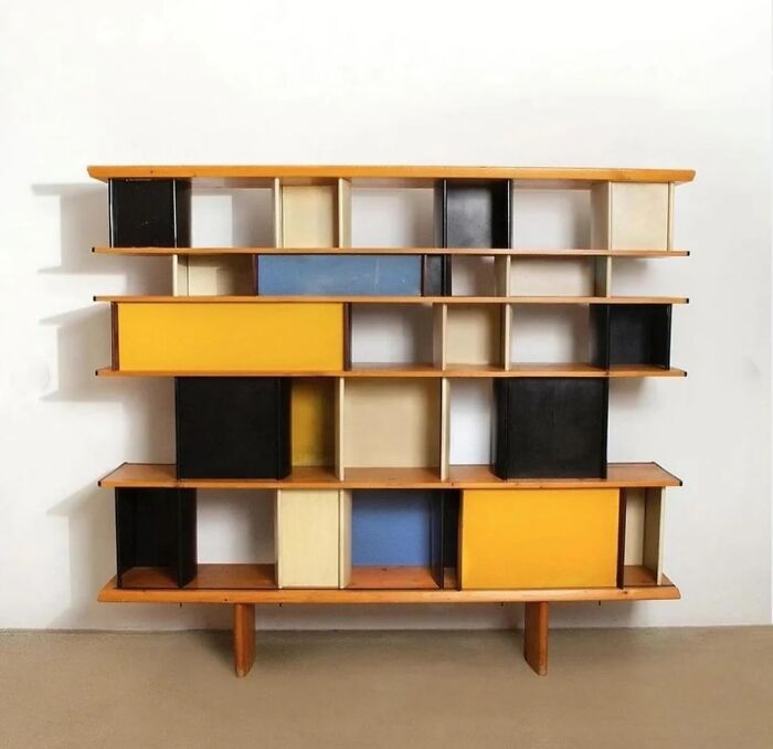 A remarkable iconic furniture piece, a multi-colored modern bookshelf with various cubbies and a few drawers in different colors.