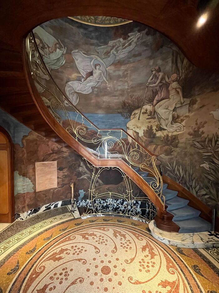 Remarkable Designs of an iconic winding staircase with an elaborate mural and intricate floor mosaic.