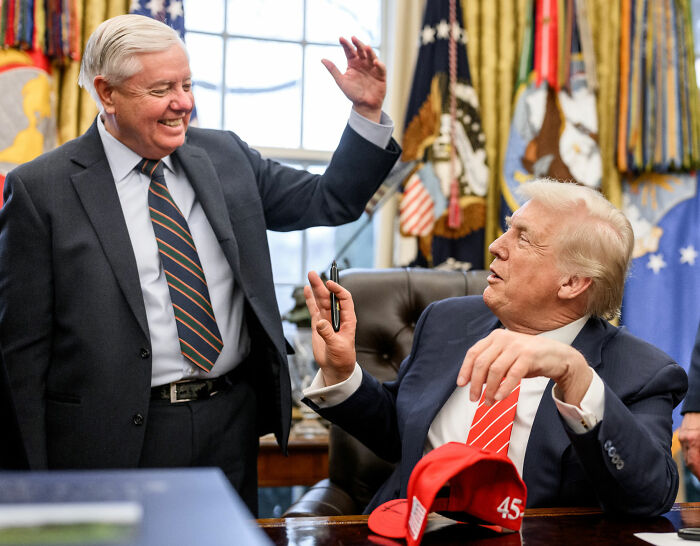 Senator Lindsey Graham smiling and high-fiving Donald Trump in the Oval Office, discussing Trans Influencer allegations. Senator Lindsey Graham smiling and high-fiving Donald Trump in the Oval Office, discussing Trans Influencer allegations.