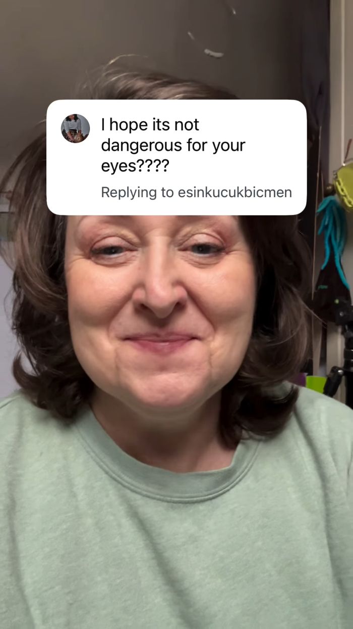 Woman smiling with a comment asking if the eye exam was dangerous for her eyes. Woman smiling with a comment asking if the eye exam was dangerous for her eyes.