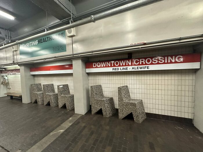 Uncomfortable concrete benches at a Downtown Crossing urban design metro station, illustrating poor urban designers planning.
