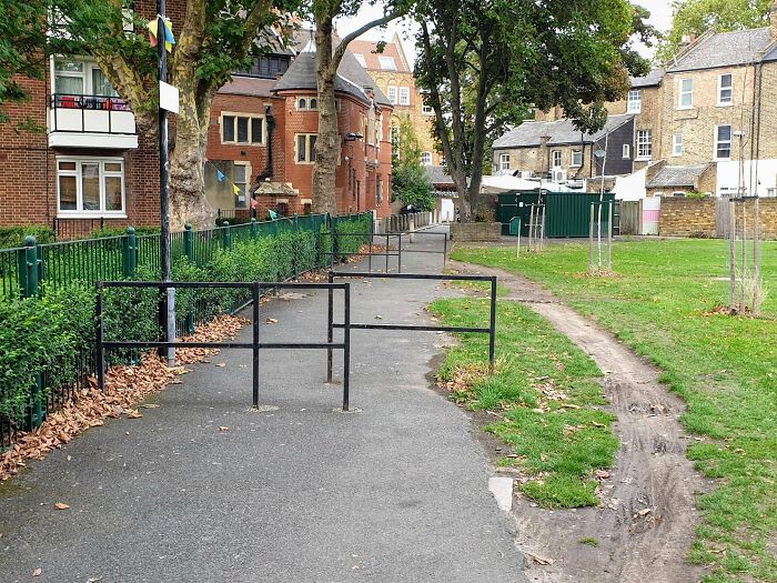 Urban designers forgot peoples comfort, with a paved path having a dirt path alongside it.