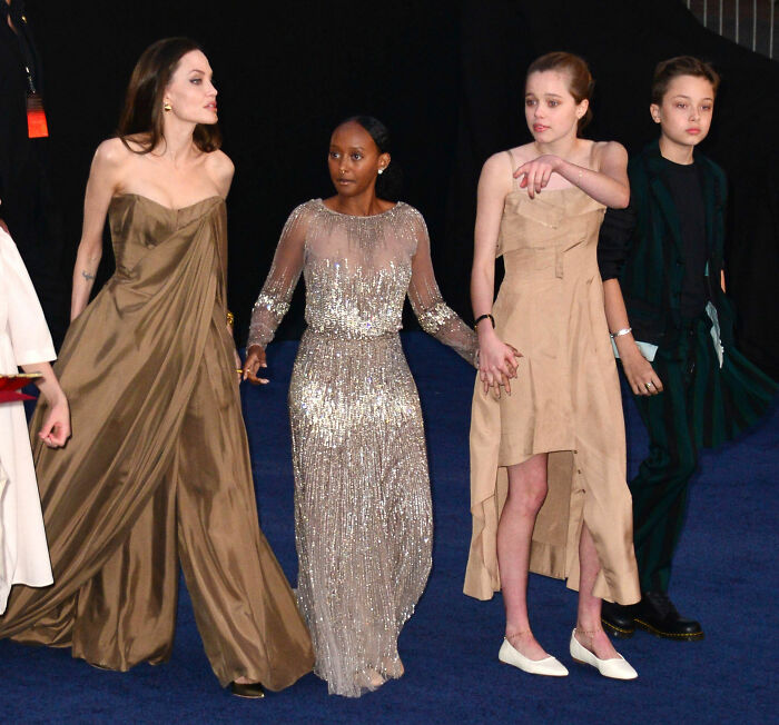 Angelina Jolie with her children on a red carpet, not directly related to Suri Cruise's legal action but often contrasted.
