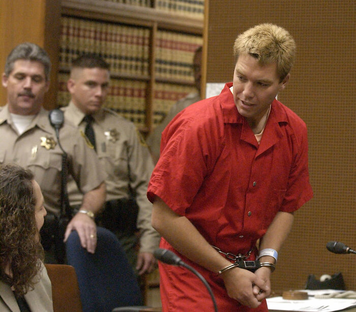 Scott Peterson in a red jumpsuit and handcuffs, awaiting new evidence in the Laci Peterson homicide. Scott Peterson in a red jumpsuit and handcuffs, awaiting new evidence in the Laci Peterson homicide.