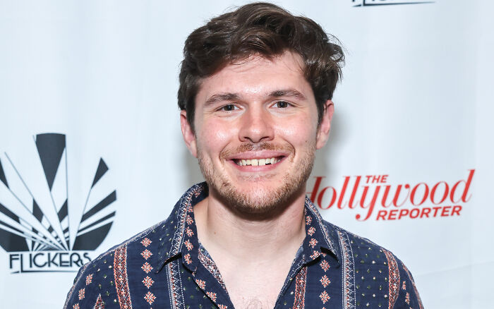 Unrecognizable Diary Of A Wimpy Kid star at 28, smiling at a red carpet event. Unrecognizable Diary Of A Wimpy Kid star at 28, smiling at a red carpet event.