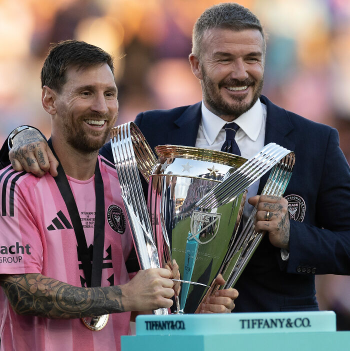 Victoria Beckham: David Beckham on Chopping Block. David with Messi, defending Victoria's behavior. Victoria Beckham: David Beckham on Chopping Block. David with Messi, defending Victoria's behavior.