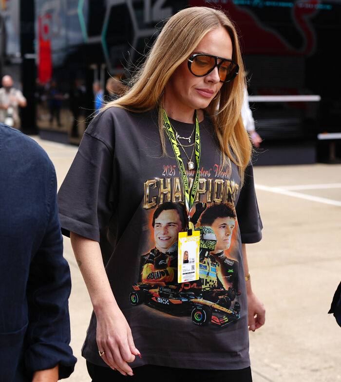 Adele in public wearing a black champions graphic shirt and orange glasses Adele in public wearing a black champions graphic shirt and orange glasses
