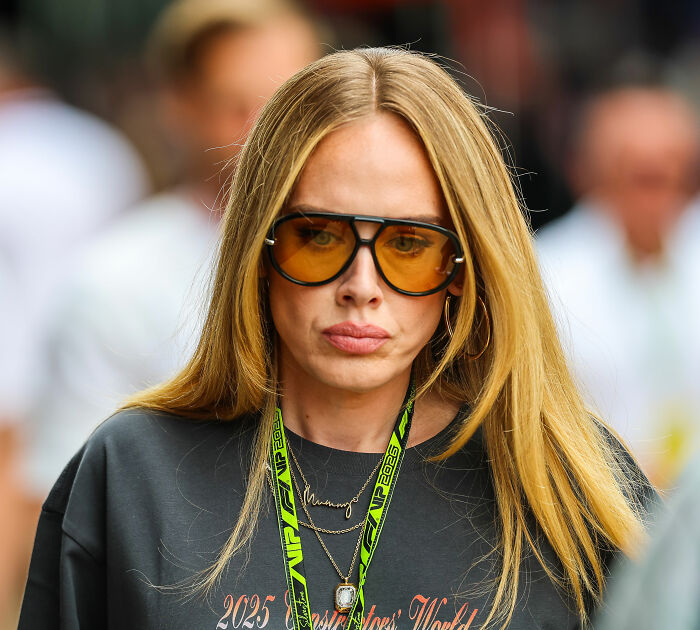 Close-up of Adele wearing orange tinted glasses in public Close-up of Adele wearing orange tinted glasses in public