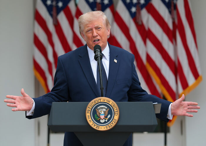 USA President Donald Trump at a podium with American flags, relating to Ryanair's World Cup mock. USA President Donald Trump at a podium with American flags, relating to Ryanair's World Cup mock.