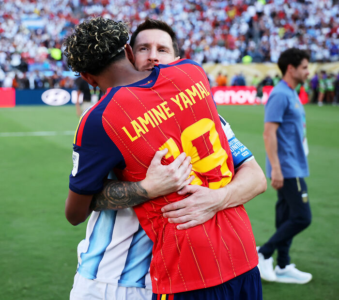 Lionel Messi embraces an opposing player after Argentina's World Cup loss. Lionel Messi embraces an opposing player after Argentina's World Cup loss.