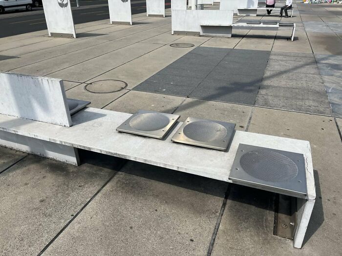 Urban designers forgot peoples comfort, with a bench having metal grates.