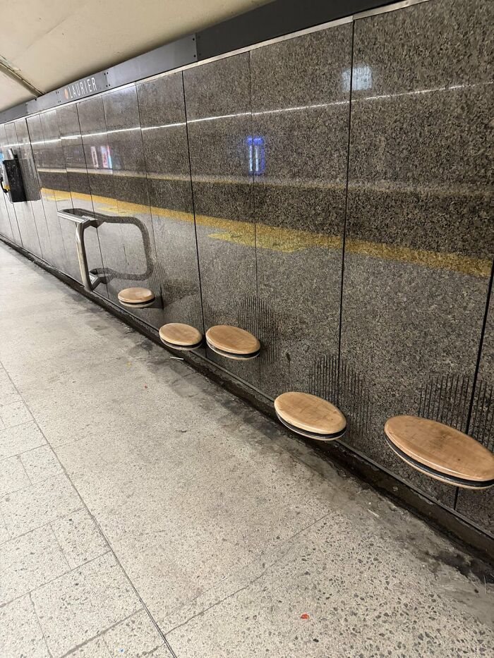 Urban designers ignored people's comfort, installing tiny, impractical wall-mounted seats in a subway.