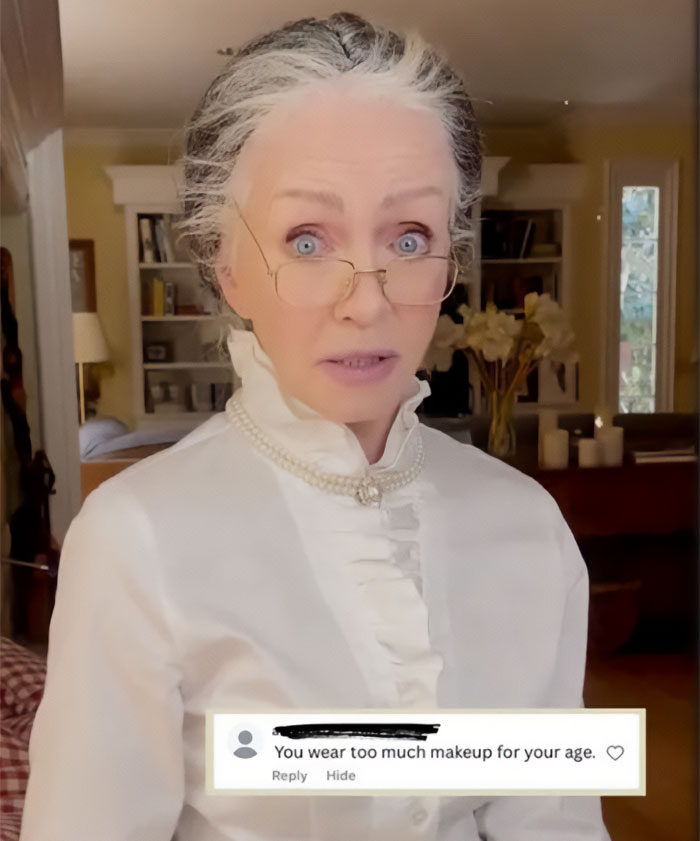 A Hollywood star, dressed in a white ruffled shirt and glasses, looking surprised while discussing an adult content platform at 85. A Hollywood star, dressed in a white ruffled shirt and glasses, looking surprised while discussing an adult content platform at 85.