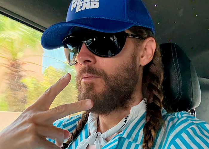 Jared Leto in a car, wearing a blue cap and sunglasses, facing new predator allegations. Jared Leto in a car, wearing a blue cap and sunglasses, facing new predator allegations.