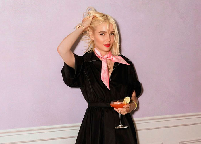 Woman in a black dress holding a drink, one of the four women making new allegations against Jared Leto. Woman in a black dress holding a drink, one of the four women making new allegations against Jared Leto.