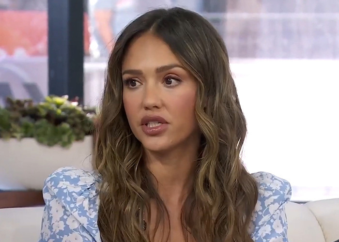 Actress Jessica Alba in a light blue floral top, connected to her kidnapping and other unsolved celebrity mysteries.