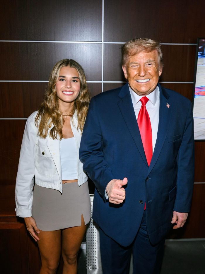 Kai Trump stands next to Donald Trump, who gives a thumbs up, during her ESPYs interview.