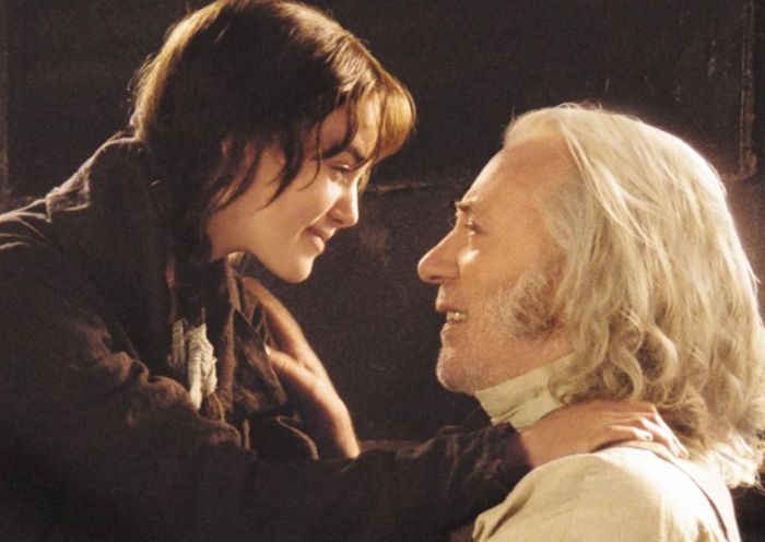 Donald Sutherland and Keira Knightley in a film still, looking at each other closely with soft smiles.