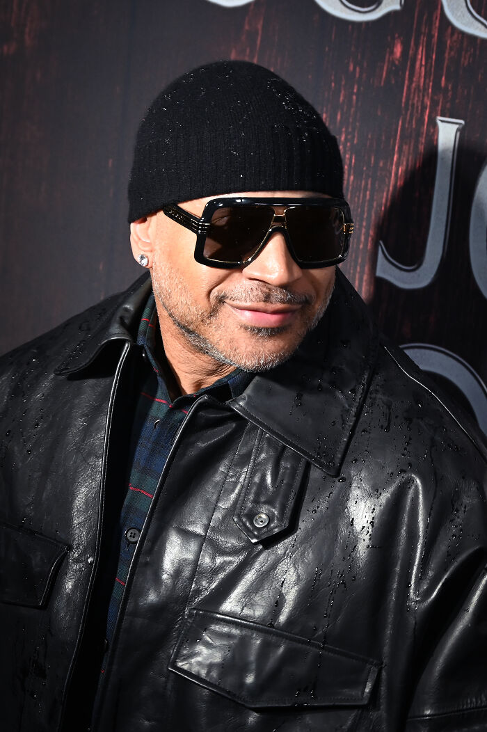 LL Cool J, a famous celebrity, in a black beanie, sunglasses, and leather jacket, exuding a cool vibe, among favorite celebrities.