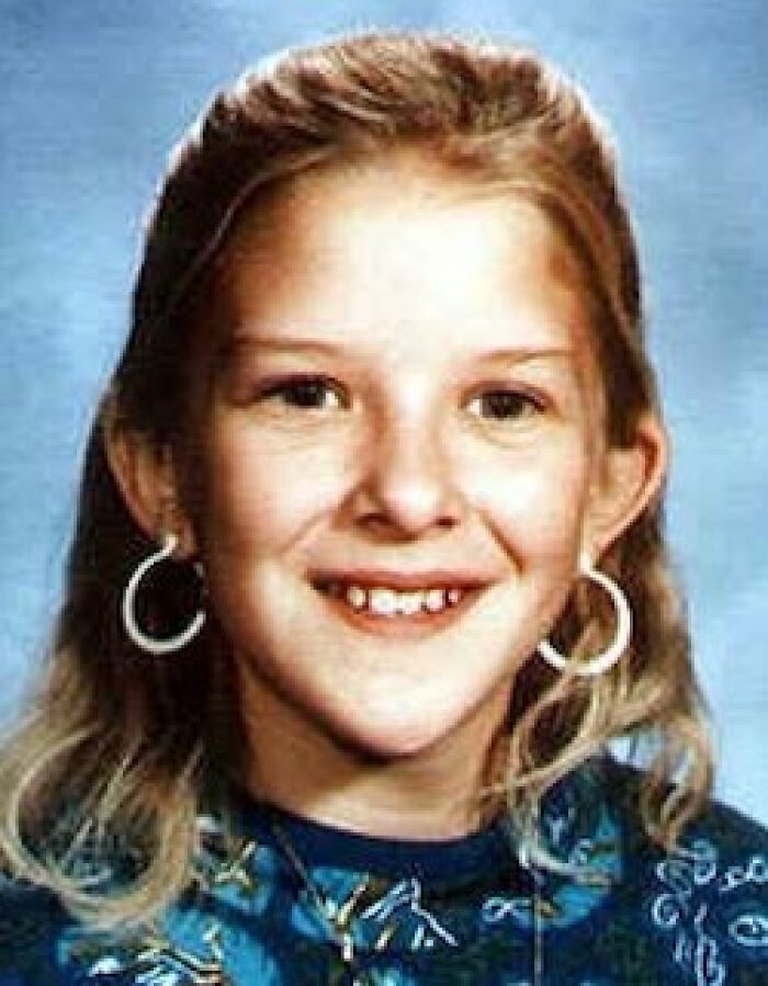 A young girl with long blonde hair and white hoop earrings, smiling, linked to unsolved mysteries.