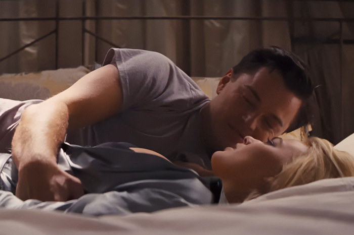 Leonardo DiCaprio and Margot Robbie in an intimate scene, revealing behind-the-scenes chaos.