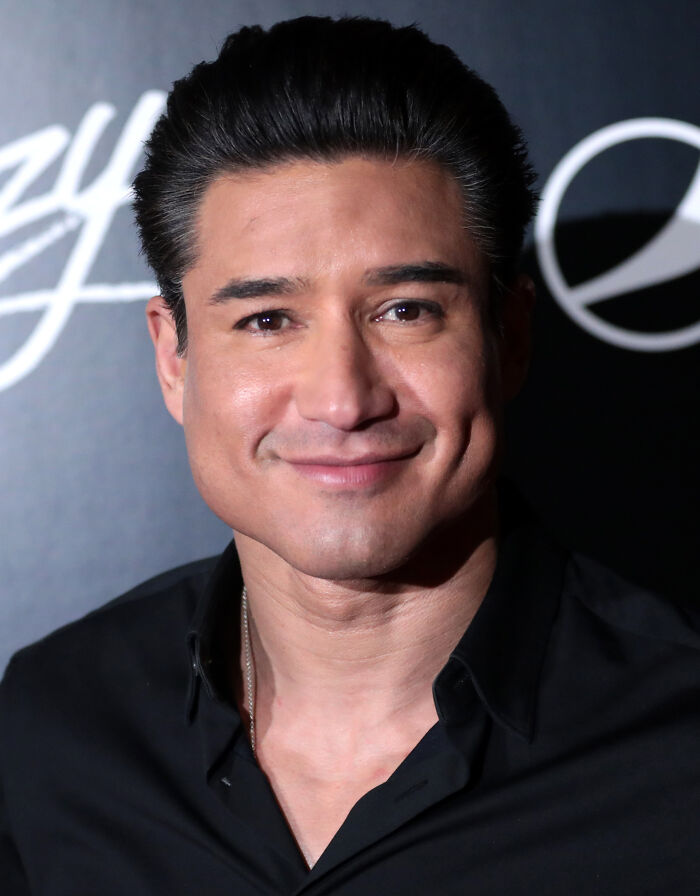 A smiling male celebrity with dark hair, wearing a black shirt, in a close-up shot. Favorite celebrities often disillusion people.