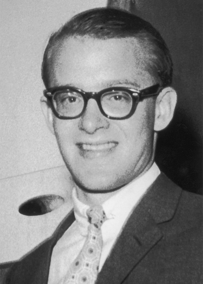 Black and white portrait of a young man in glasses. A celebrity mystery that is still unsolved.