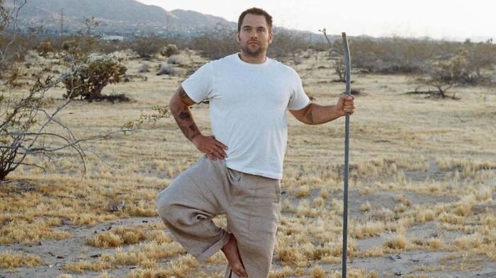 Hollywood Star Dylan Sprayberry doing a purification ritual pose in a desert landscape. Hollywood Star Dylan Sprayberry doing a purification ritual pose in a desert landscape.