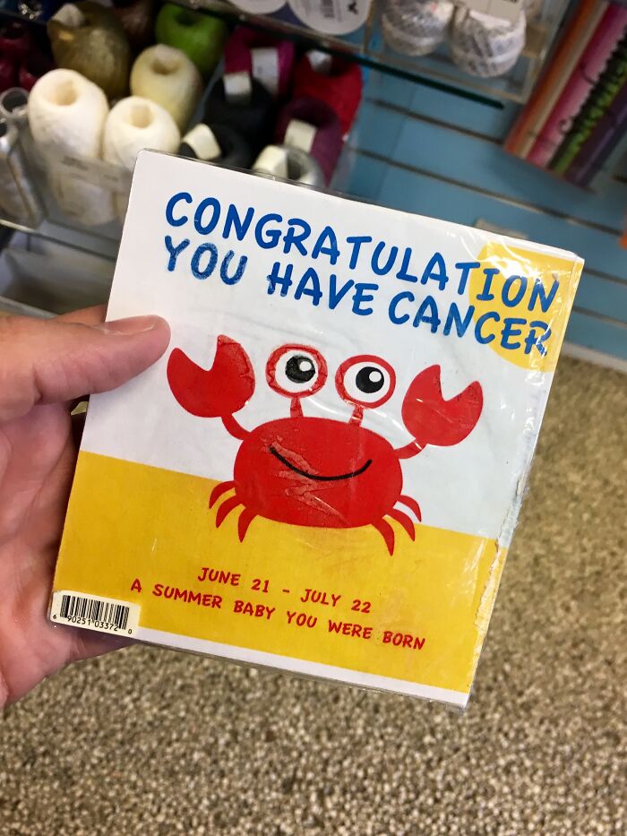 A greeting card with a crab and the inappropriate message CONGRATULATION YOU HAVE CANCER, a design fail.