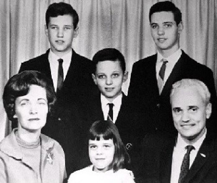 A black and white photograph of a family of six, three adult males, a young boy, a young girl, and an adult woman, connected to unsolved mysteries.