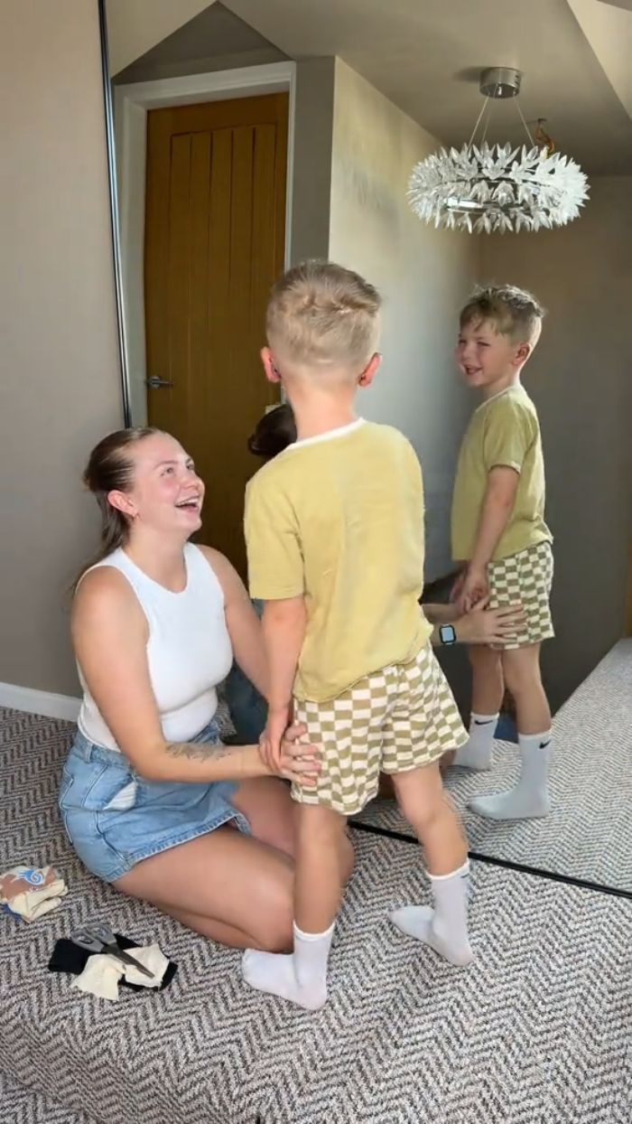 A mom and her 5YO boy smile, reflecting on his cosmetic surgery, a controversial choice. A mom and her 5YO boy smile, reflecting on his cosmetic surgery, a controversial choice.